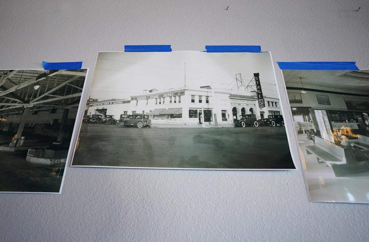 Vintage photographs are taped to a wall of the historic Anchor Stage Depot on Fulton Street Tuesday, Feb. 5, 2021 in downtown Fresno. The building at Fulton and Mono streets is up for rent.