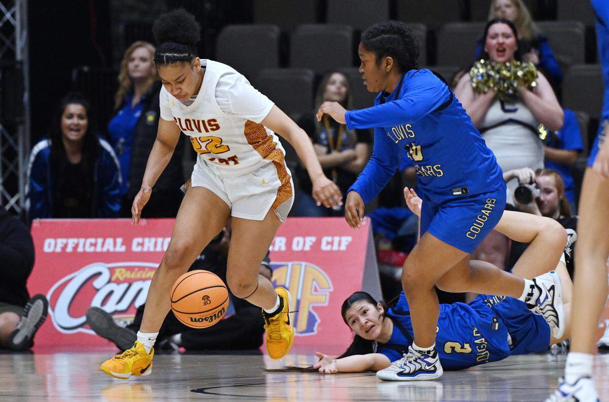 Clovis West’s Riley Walls, left, chases a loose ball in the CIF Division I Girls Basketball Championship game against Clovis High Saturday, March 1, 2025 in Fresno.