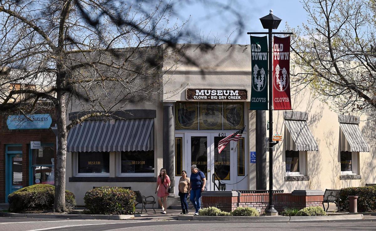 Pedestrians stroll along Pollasky Ave. Wednesday, March 26, 2025 in Old Town Clovis. Cowboy Cleanup will bring one hundred volunteers together to clean the streets, shops and intersections of Old Town Clovis on Saturday, March 29 in preparation for rodeo events in April.