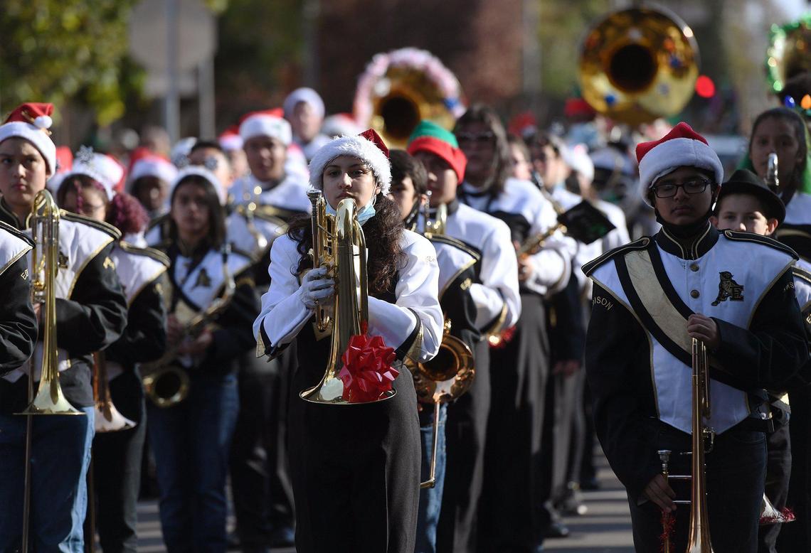 The Edison High marching band is seen in the 92nd Annual Downtown Christmas Parade, held along Fulton Street from Inyo to Calaveras Saturday, Dec. 11, 2021 in Fresno. The theme was originally planned for the 2020 event but was canceled due to the COVID-19 pandemic.