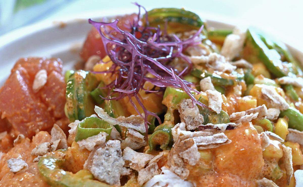 A poke bowl topped with purple Ogo Seaweed is created to a customer's order at the new Poke House, located at The Avenue at Heritage Grove, Wednesday, May 20, 2026 in Clovis.
