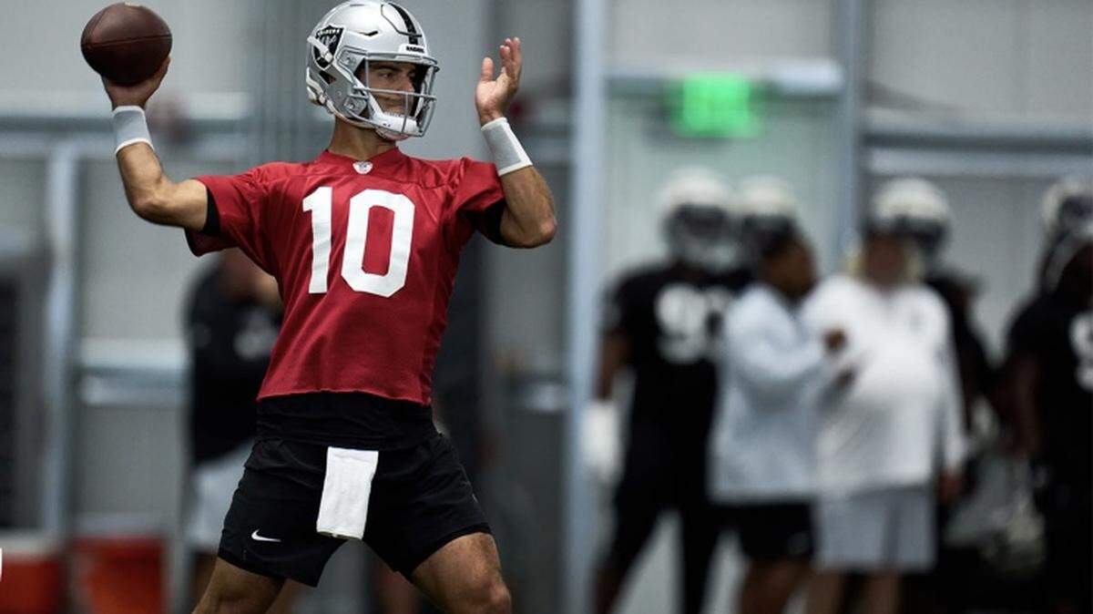 Las Vegas Raiders quarterback Jimmy Garoppolo makes a throw during training camp.