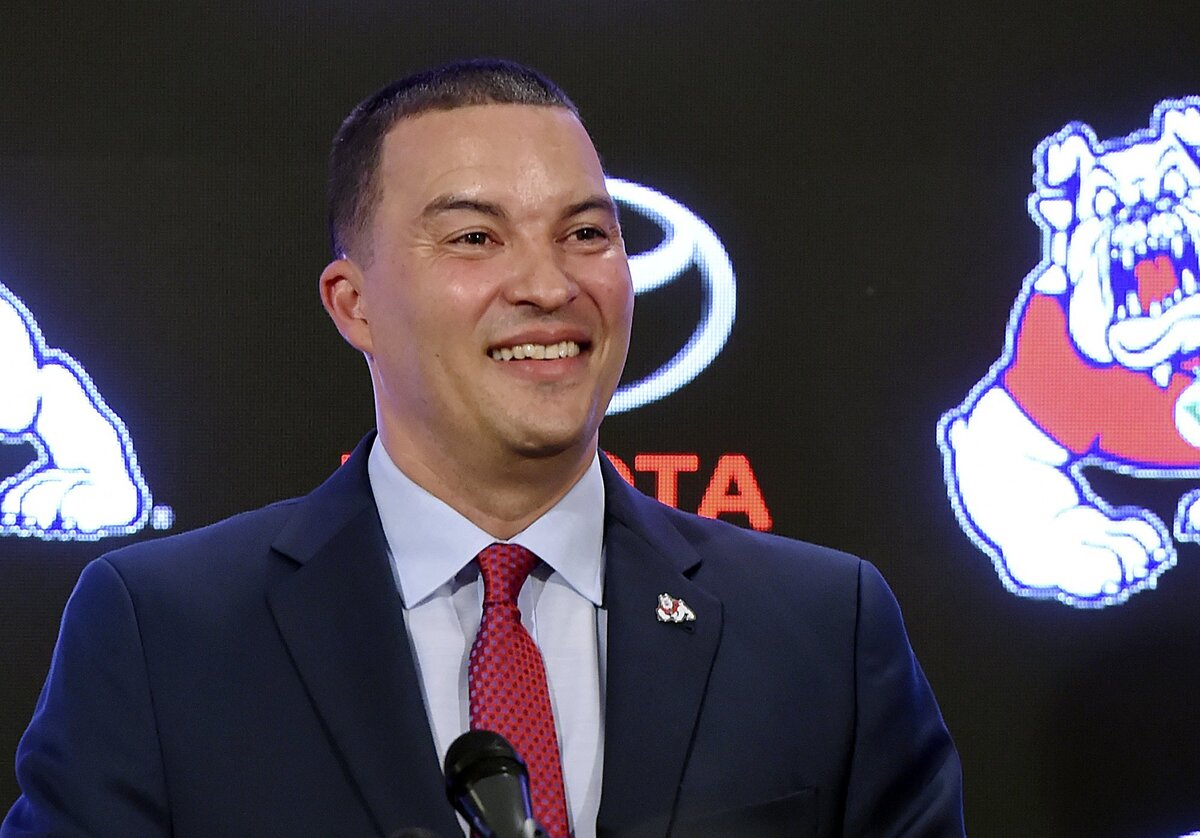 Justin Hutson smiles as he answers questions after being introduced as Fresno State's 19th head men's basketball coach at a news conference Thursday, April 5, 2018 in Fresno.
