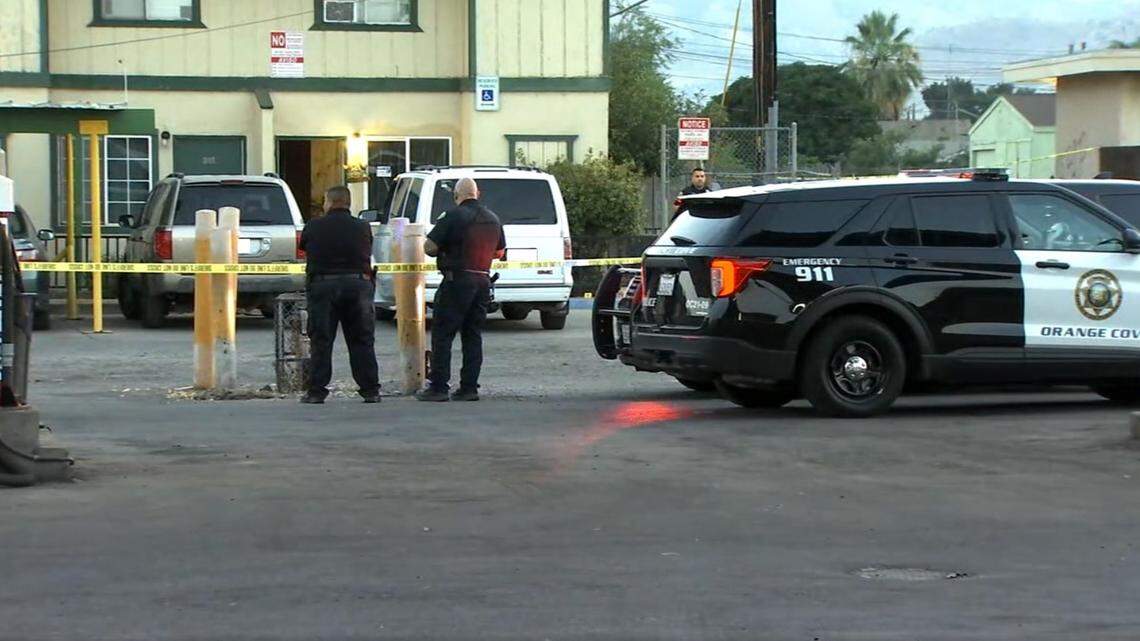 Orange Cove police and Fresno County Sheriff’s Office deputies look over the scene of a fatal shooting of a 14-year-old girl on Wednesday, July 27, 2022.