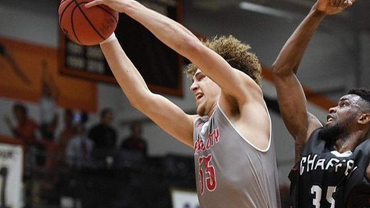 Fresno City College center Ethan Richardson grabs a rebound Thursday, March 14, 2019 against Chaffey in the state quarterfinals.