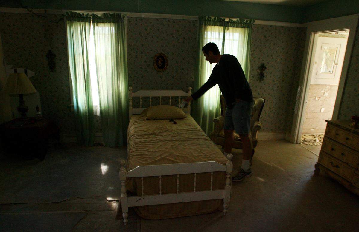 Wolfe Manor owner Todd Wolfe stops in Mary’s Room during a tour of the Clovis home he’s used for haunted tours on Monday, Oct. 22, 2007. He said paranormal investigators have said the room is haunted by a spirit named Mary.