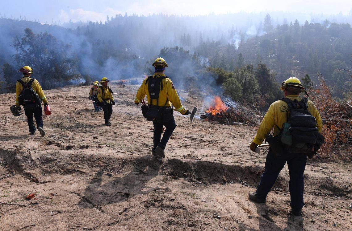 Firefighters conduct a fuels reduction project along Sugarloaf Road as Calfire teamed with USFS and California National Guard firefighters in a burning effort Wednesday, Feb. 10, 2021 north of Meadow Lakes.