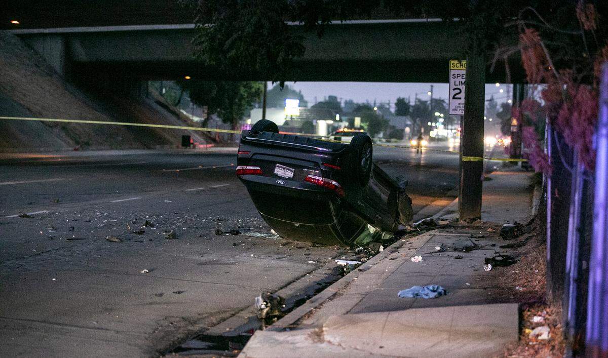 A crashed vehicle is taped off after a collision Thursday, Aug. 19, 2021, in central Fresno.