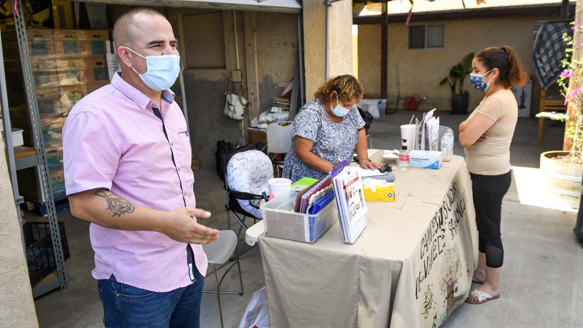 Arturo Rodriguez, board president, Poplar Community Services District, stands outside the Larry Itlong Resource Center in Poplar during a food distribution event on Thursday, May 6, 2021.