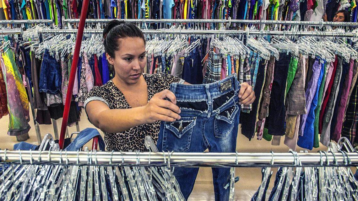 Erica Mendez, 24, a mother of two young children said this was her first trip to a thrift store in this file photo taken in Anaheim, California. She usually shops at Ross or Nordstrom Rack but was amazed at the low prices of used clotting at Savers thrift store in Anaheim.