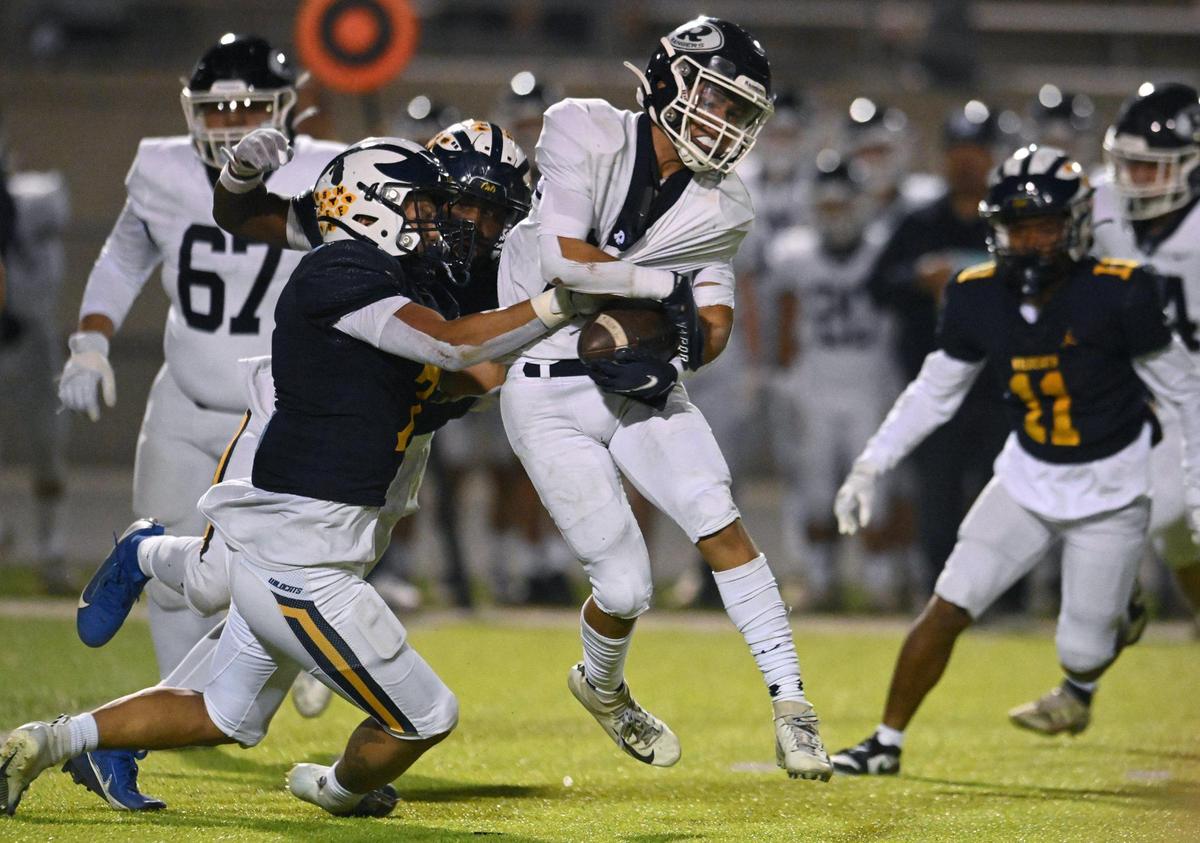 Sunnyside’s Vian Vang, left, and Daequan Jones, background, tackle Redwood’s Jimmie Burk, right, in the Central Section D2 playoff game Friday, Nov. 3, 2023 in Fresno. Sunnyside won the game 39-21.