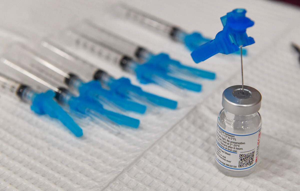 Syringes with Moderna COVID-19 vaccination doses await administering during a Fresno County rural vaccine clinic at Orange Cove High School on Tuesday, March 16, 2021.