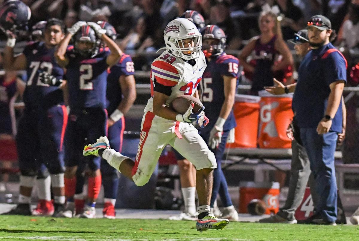 Buchanan’s Michael Runnels dashes down the sideline before scoring a touchdown on a long run against Memorial during their game at San Joaquin Memorial on Friday, Sept. 16, 2022.
