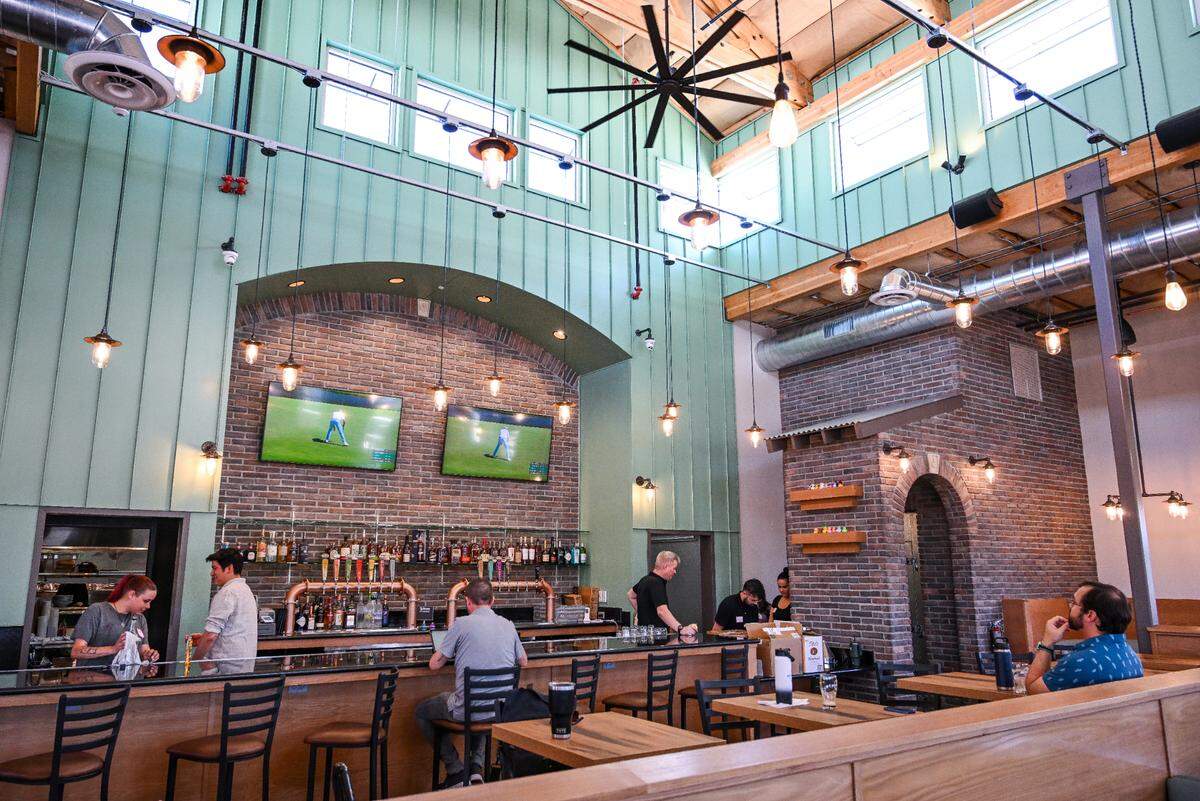 High, airy ceilings lined with windows allow natural light into the new Mad Duck location at Maple and Copper where their signature archways and brick accents give a welcoming vibe in the dining room and bar built from the ground up.
