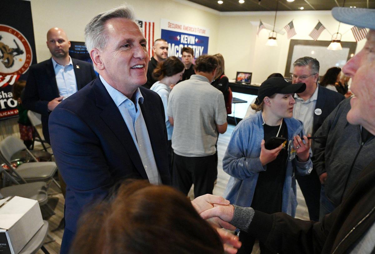 Congressman Kevin McCarthy (R), left, greets and welcomes visitors and supporters at the grand opening of his new headquarters Saturday, March 19, 2022 in Clovis.