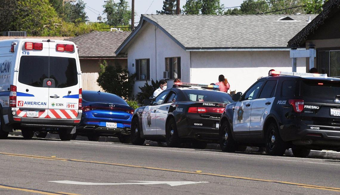 Police respond to the scene of a reported stabbing at a home along Gettysburg Avenue just west of First Street Saturday afternoon, April 9, 2022, in Fresno.