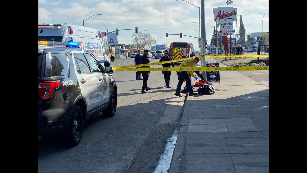 Police investigate the scene after a stabbing Thursday, March 16, 2023, near downtown Fresno.