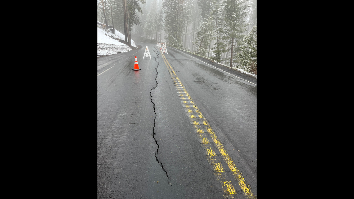 A cracked road on Big Oak Flat Road (continuation of Highway 120 west into Yosemite) to Yosemite Park is closed.