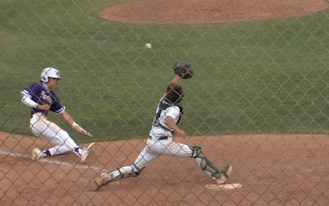 Davin Finderup of Washington Union slides home against Kingsburg in a Central Section Division II semifinal game.