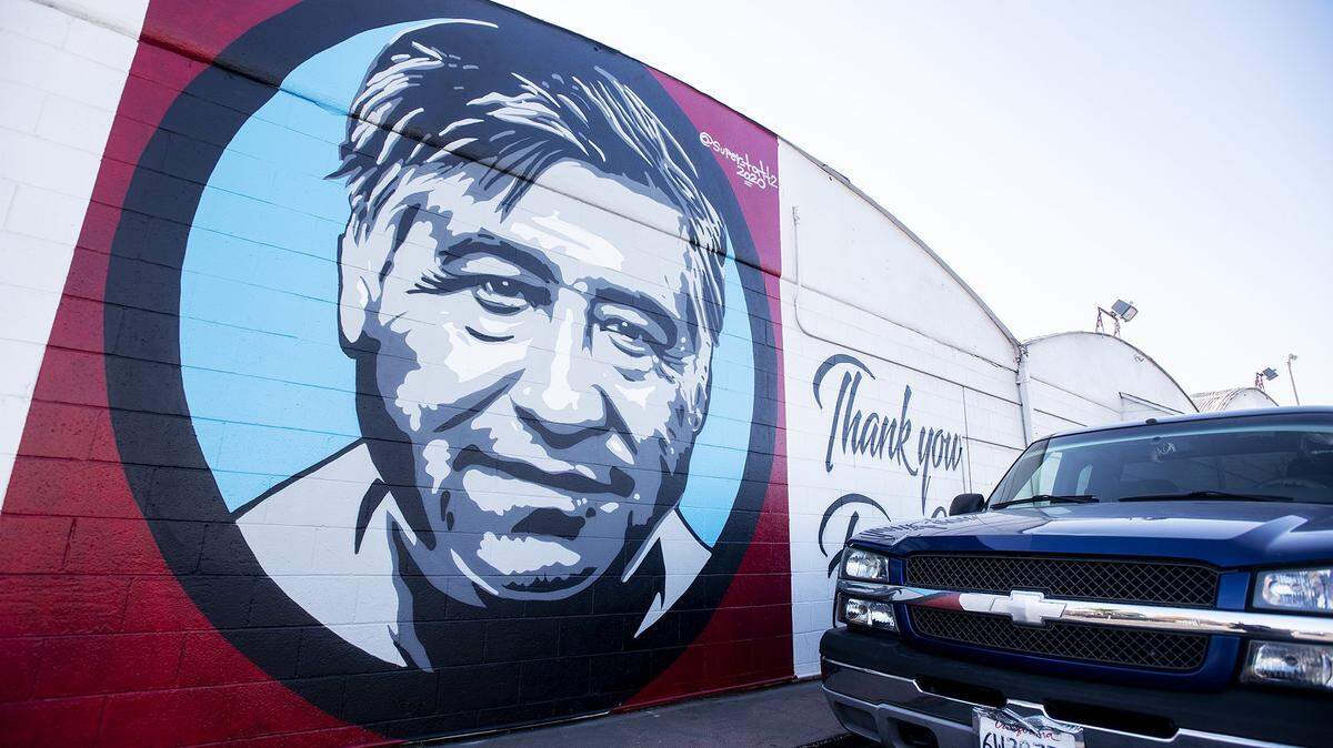 A mural of Cesar Chavez that reads “Thank you Farm Workers,” is seen on the side of building near the intersection of West 12th Street and Martin Luther King Jr. Way in Merced, Calif., on Thursday, Dec. 3, 2020. Chavez founded the National Farm Workers Association.