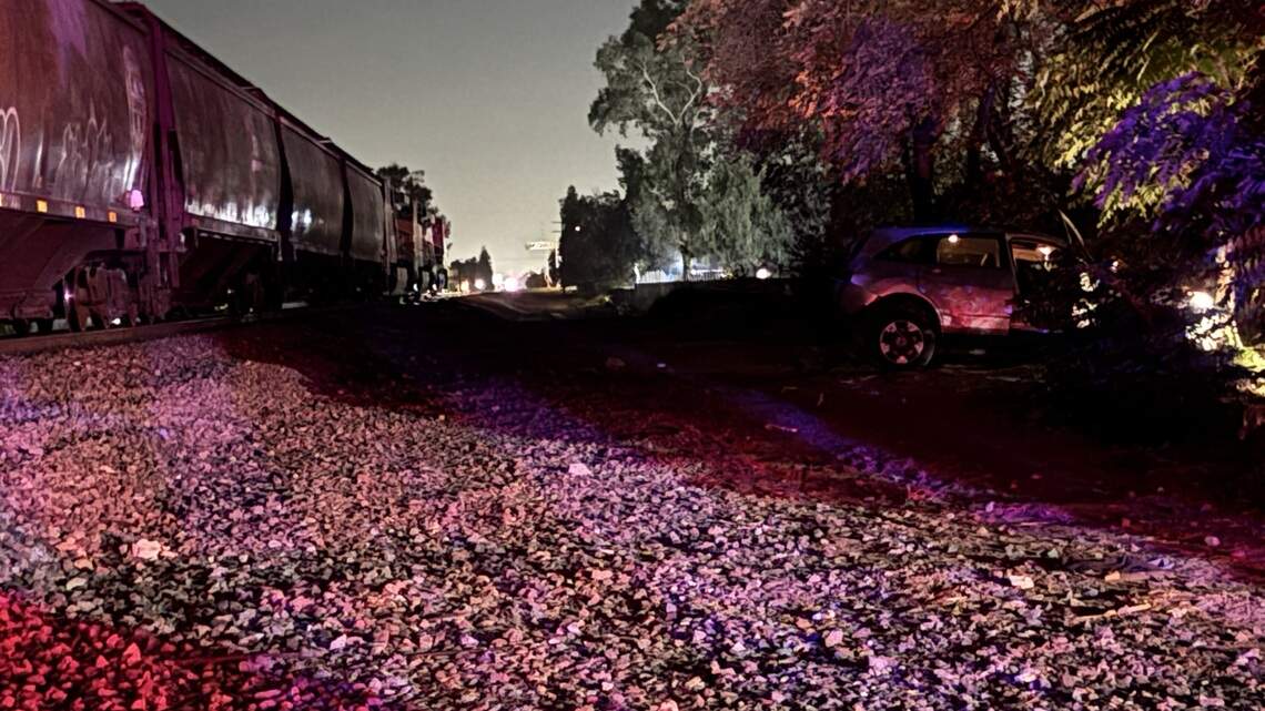 Man hospitalized after vehicle is struck by train in Fresno while driving on tracks