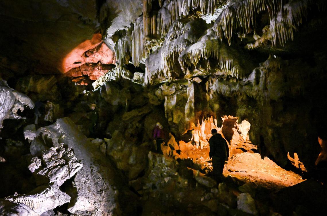 Visitors walk through Marble Hall in Sequoia National Park’s Crystal Cave before reopening officially to the public following years of closures due to COVID, fires and floods.