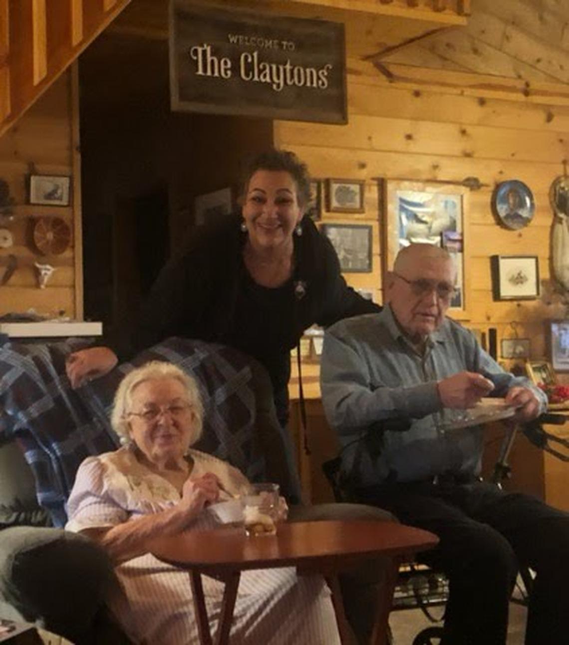 Lynda Clayton Cuzzort, center, and her parents Glenn and Caryl in the family’s cabin pre-Creek Fire. 