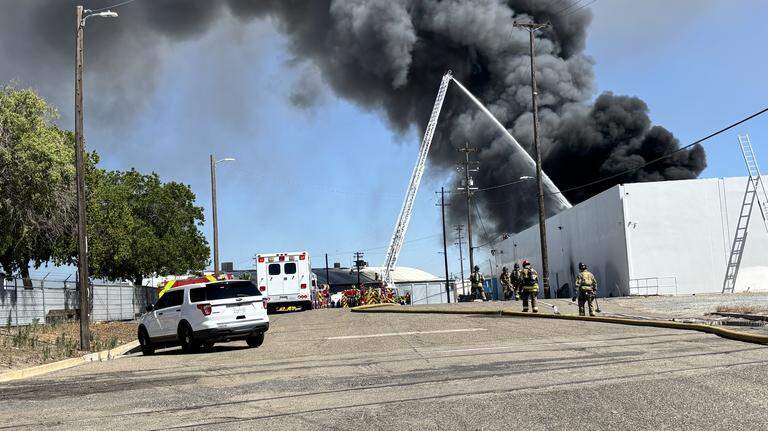 Two-alarm warehouse fire sends black smoke visible for miles near downtown Fresno
