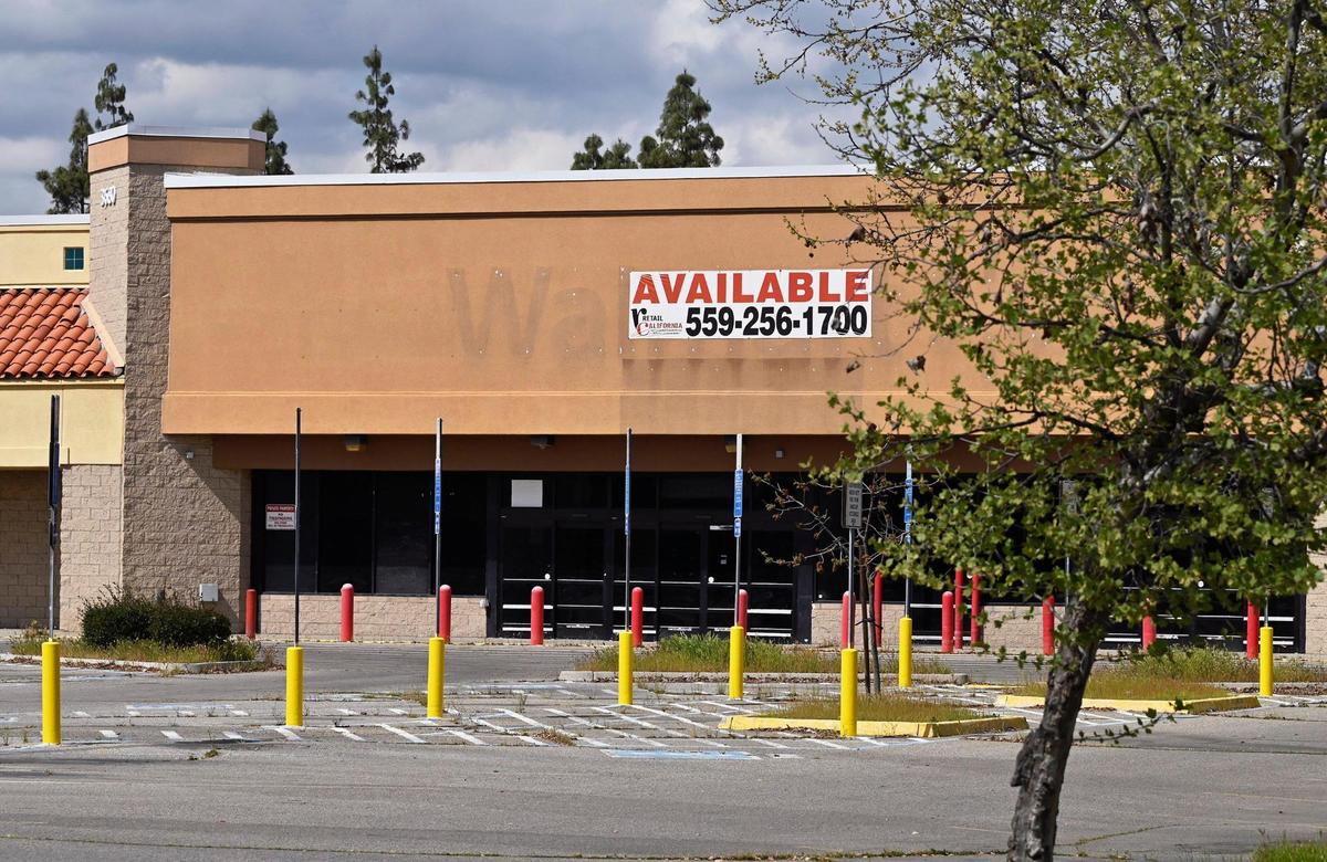 Two new businesses have signed a lease for the former Walmart on West Shaw Avenue as construction workers work on the sprawling structure near Brawley Avenue.