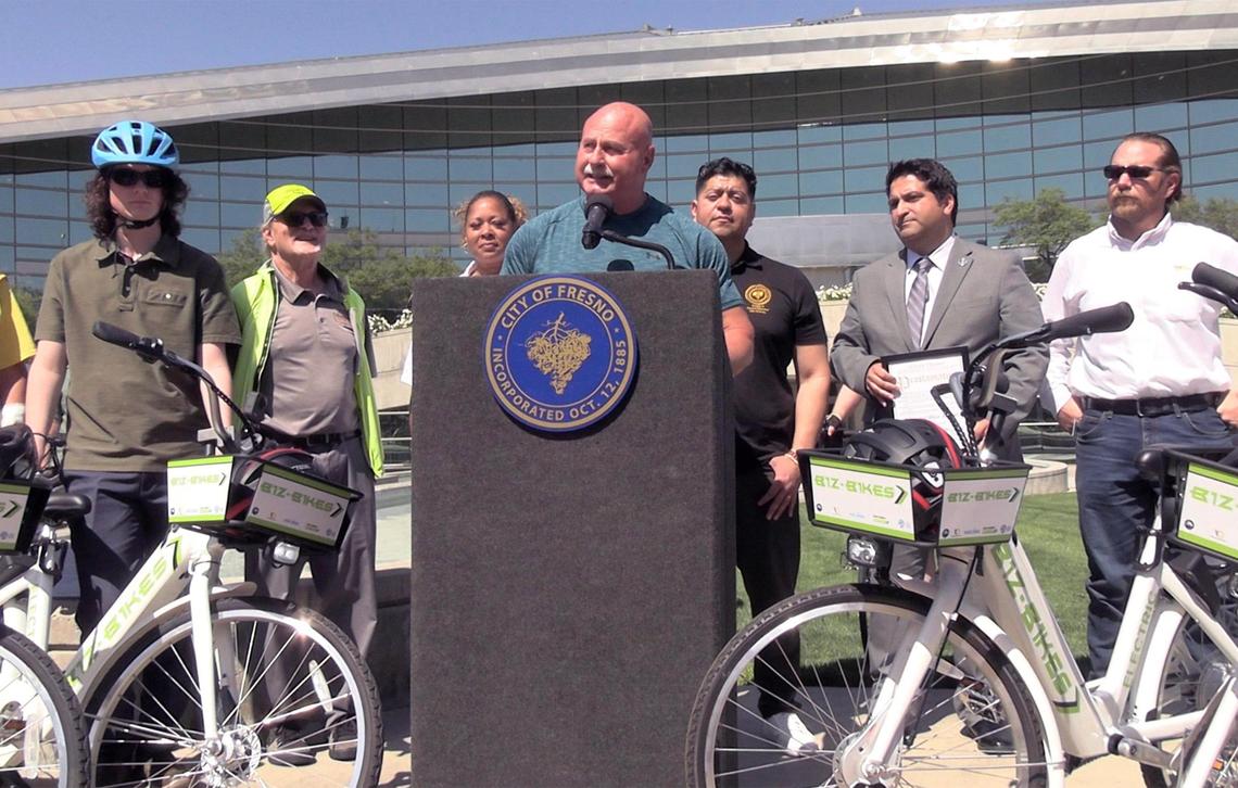 Fresno Mayor Jerry Dyer, center, addresses dozens in front of Fresno City Hall as a Bike Ride With The Mayor event begins Wednesday, May 10, 2023 in Fresno.