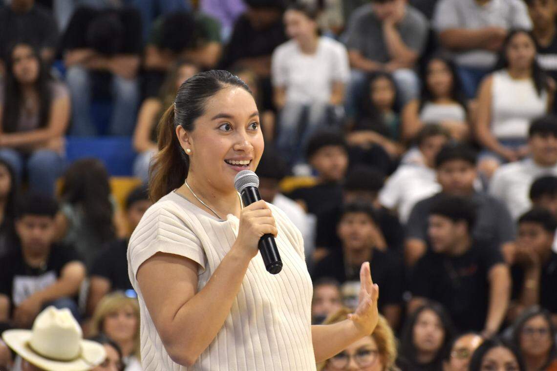 Katya Echazarreta, the first Mexican-born woman to fly to space, speaks to a crowd of mostly Latino students in the gym at Parlier High School on Aug. 29, 2024.