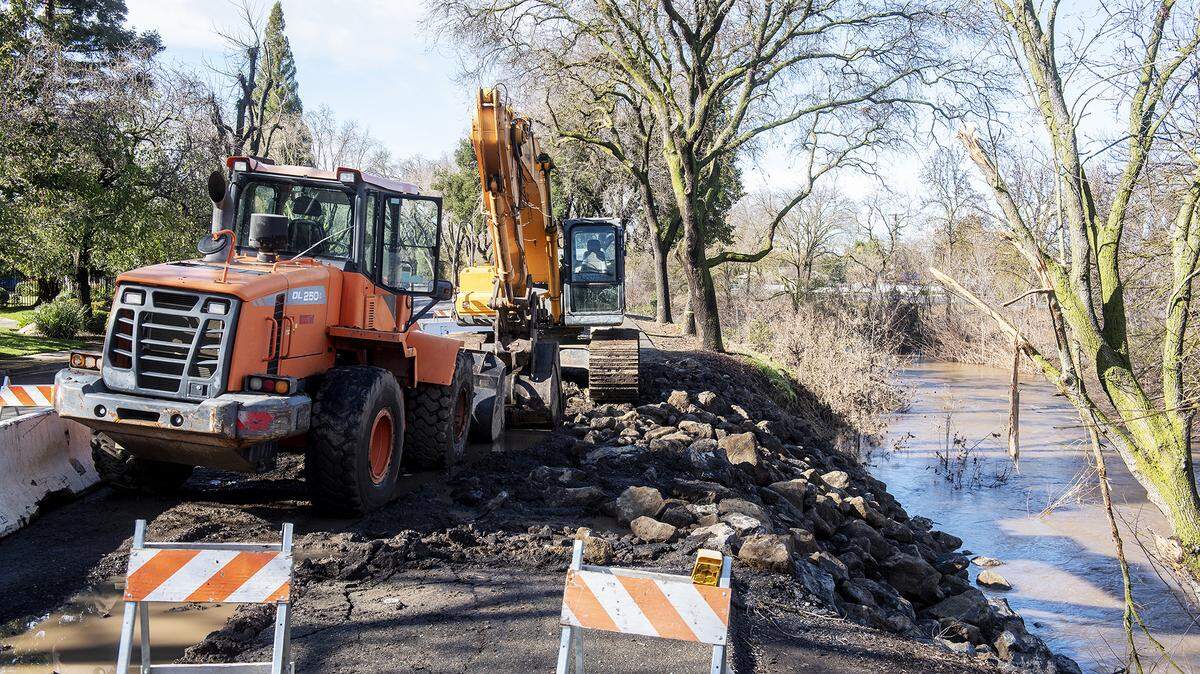 A damaged section of pathway along East South Bear Creek Drive between Glenn Avenue and Sixth Avenue in Merced, Calif., on Monday, Jan. 16, 2023.