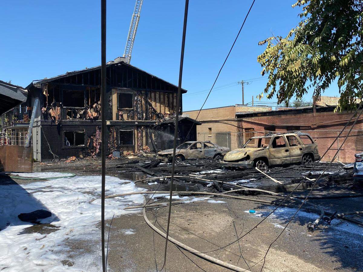 A fire at an apartment complex spread to a neighboring business in downtown, Fresno, California on Monday, July 25, 2022.