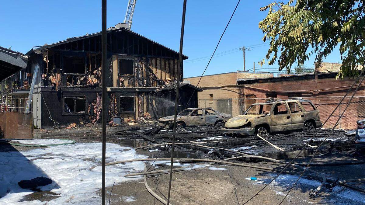 A fire at an apartment complex spread to a neighboring business in downtown, Fresno, California on Monday, July 25, 2022.