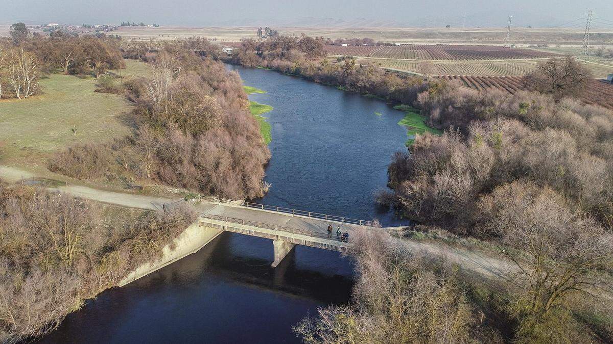 This old gravel mining bridge spanning the San Joaquin River north of Fresno connects Madera County’s Ledger Island, left, with Ball Ranch and Sumner Peck Ranch on the Fresno County side. Following two years of public use, both the bridge and Ball Ranch were closed by the San Joaquin River Conservancy.