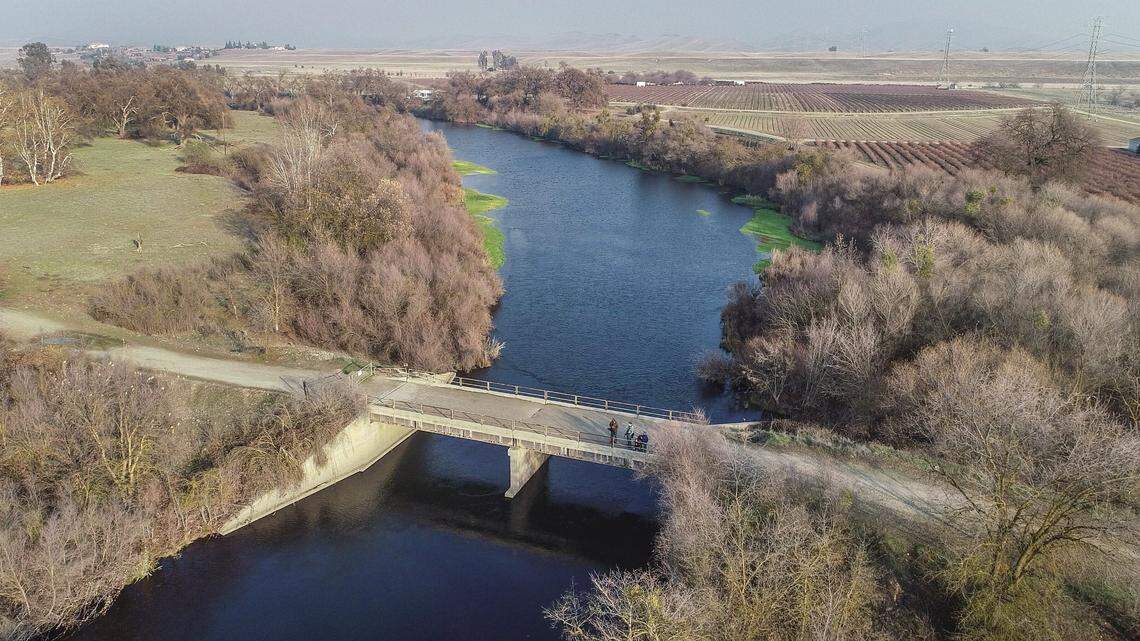 This old gravel mining bridge spanning the San Joaquin River north of Fresno connects Madera County’s Ledger Island, left, with Ball Ranch and Sumner Peck Ranch on the Fresno County side. Following two years of public use, both the bridge and Ball Ranch were closed by the San Joaquin River Conservancy.