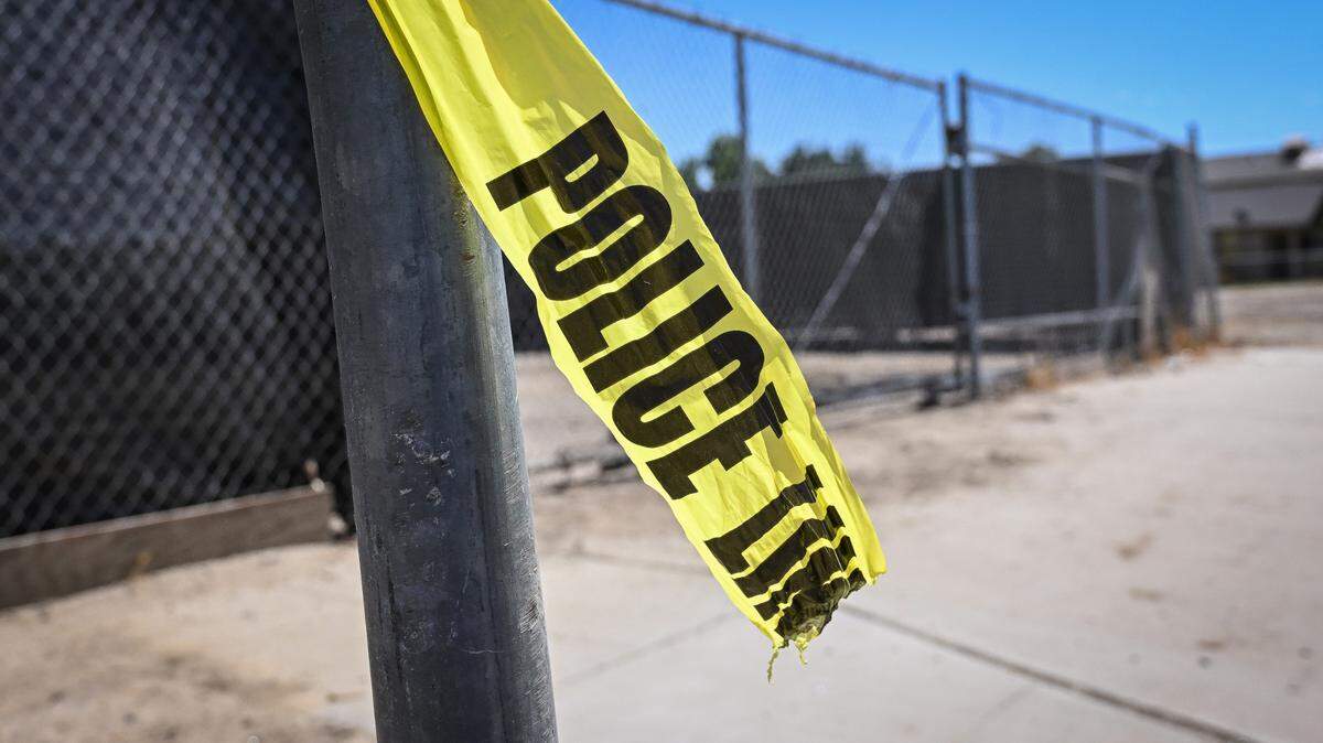 A piece of police crime scene caution tape remains tied to a mailbox post at the scene of an officer-involved shooting Mendota which occurred the night before, on Thursday, Aug. 17, 2023.