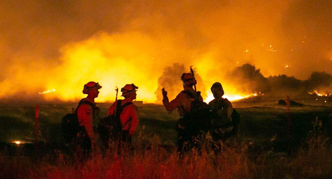 Firefighters working to slow down the spread of the “River Fire” near Road 600 in Madera County on Sunday July 11, 2021. The River Fire was at 4,000 acres with 5% containment around 10 p.m. Sunday