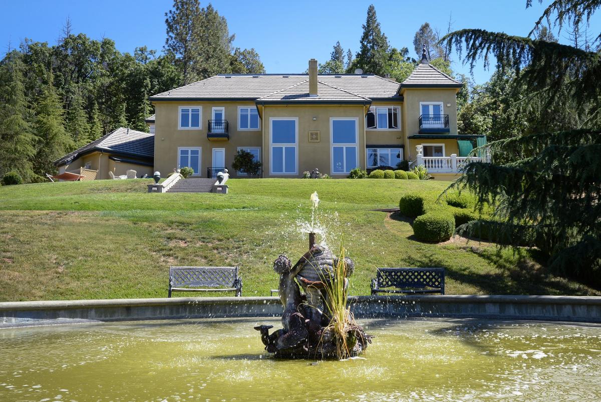 A large fountain sends pleasant trickling sounds of water up a grassy hill to a French chateau built near Oakhurst in 1993 by Erna Kubin-Clanin, the former owner of Erna's Elderberry House, and her husband René Clanin.