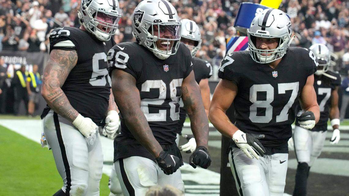 Las Vegas Raiders running back Josh Jacobs celebrates after scoring a touchdown against the Houston Texans during the first half of an NFL football game, Sunday, Oct 23, 2022, in Las Vegas.