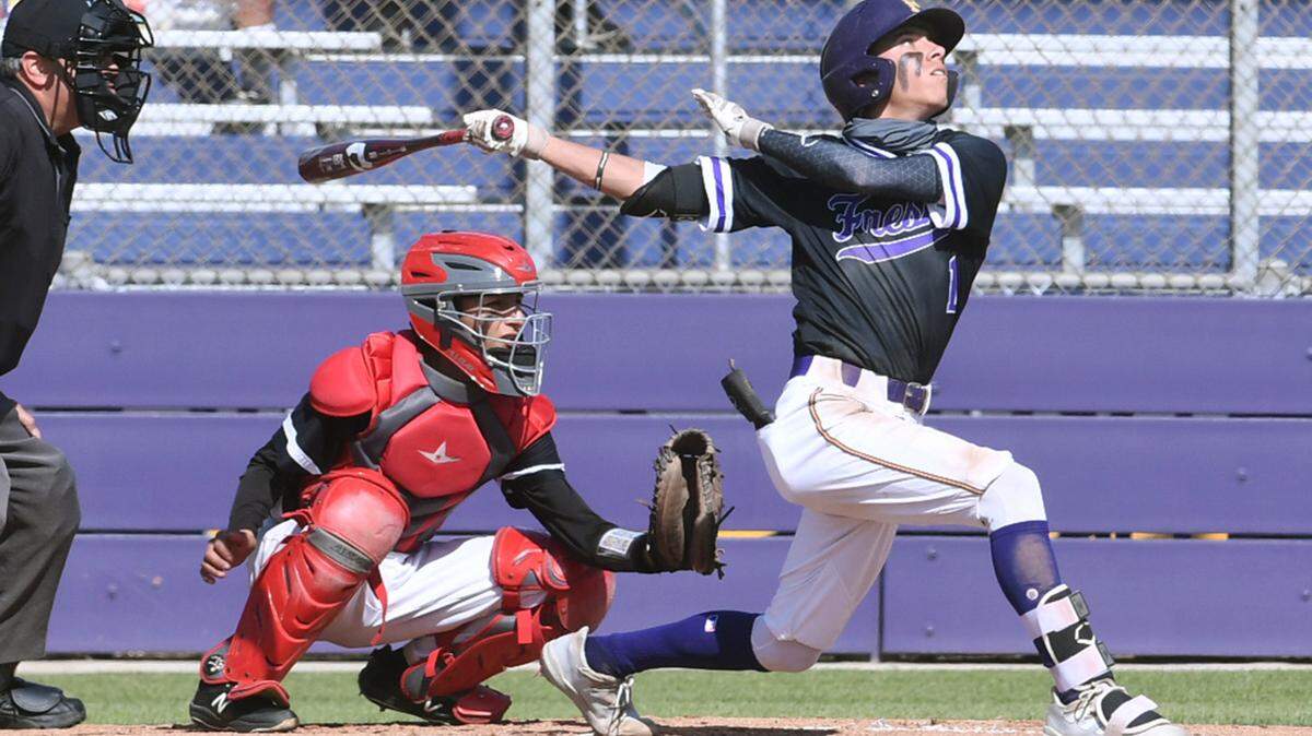 Fresno High’s Paul Marshall, right, connects for a double against McLane in a matchup Friday, April 22, 2022 in Fresno.