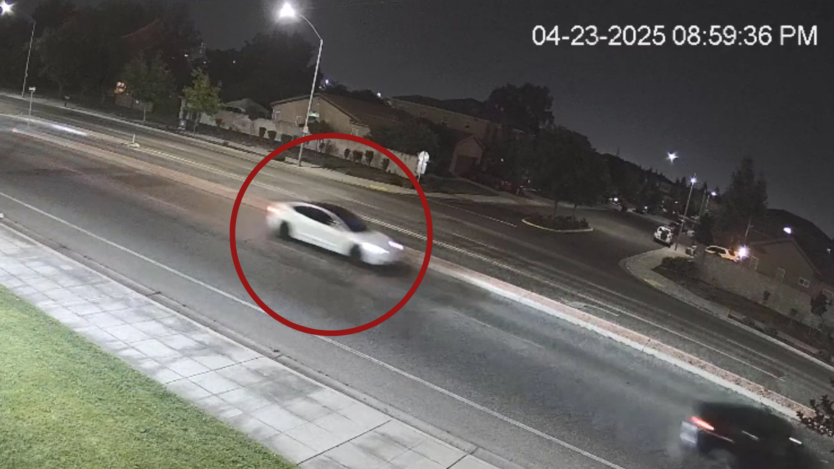 A white Tesla is shown on a surveillance video after the shooting death of Caleb Quick.