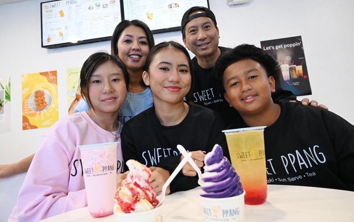 It’s a family affair with Sophea and David Thach, background, and their kids Natalie, left, Caitlyn, center and Tyler, right, operating Sweet Ppang located near First Street and Shields Avenue. Photographed Tuesday, Nov. 12, 2024 in Fresno.