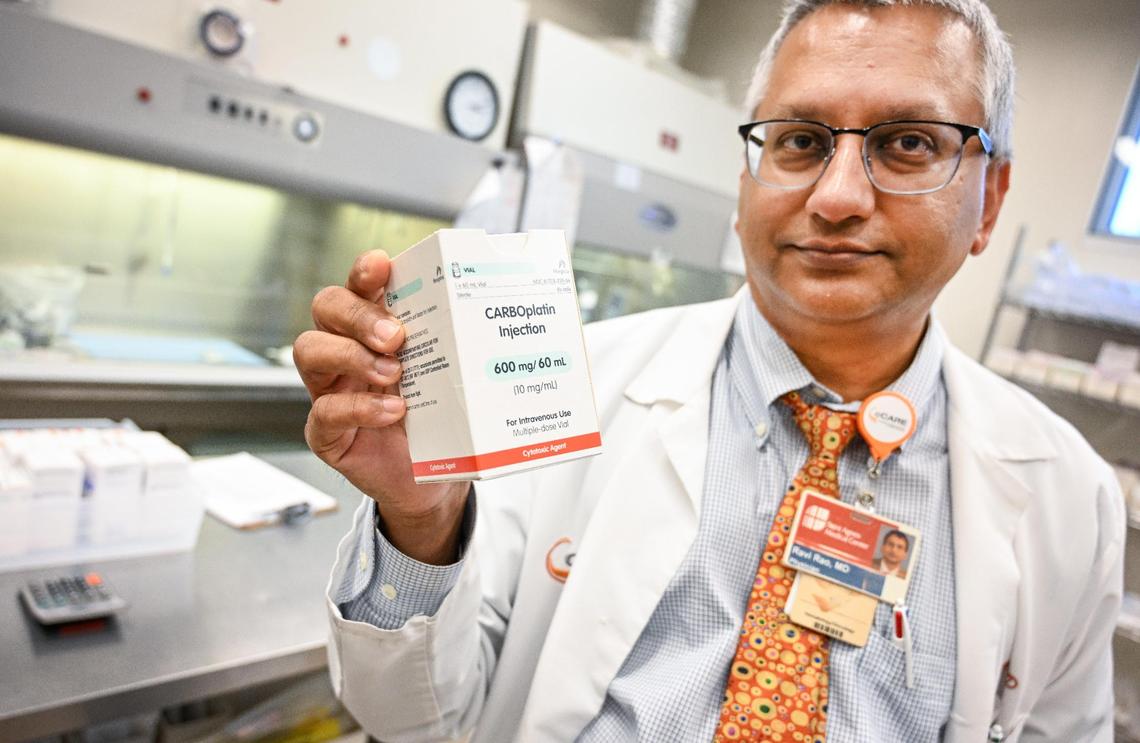Dr. Ravi Rao holds up a cancer drug at California Cancer Associates for Research and Excellence in Fresno on Wednesday, July 5, 2023. Dr. Rao has been frustrated about the shortage of cancer drugs for treating his patients.