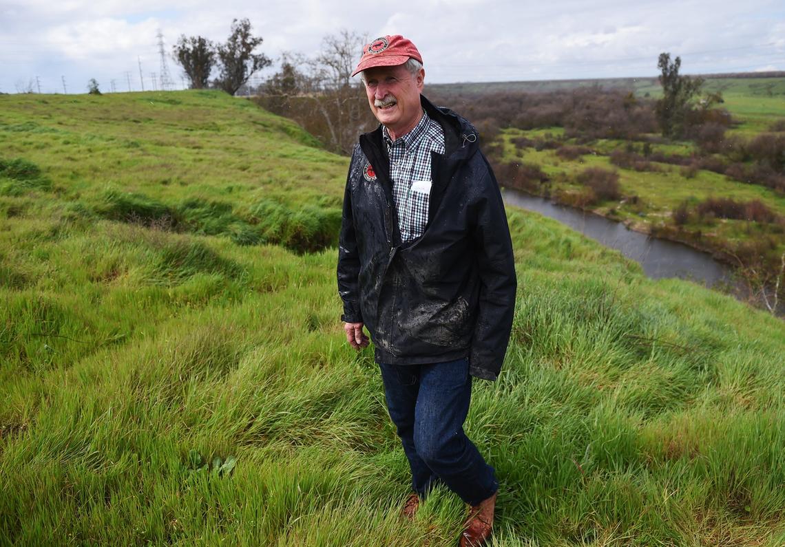 John Marshall, who owns the Fresno County Horse Park, walks along the edge of the neighboring 17.5 acre plot of land that may be rezoned for houses near the San Joaquin River and Highway 99. Photogrpahed Wednesday, March 6, 2019 in Fresno.