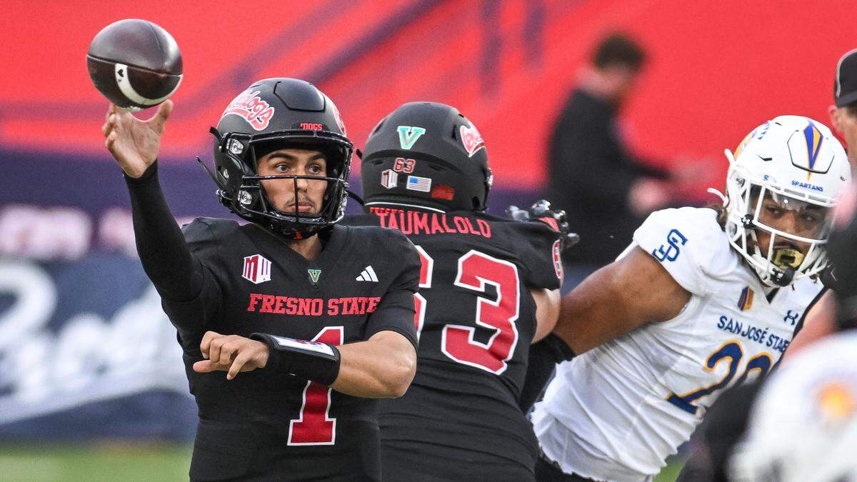 Fresno State quarterback Mikey Keene throws a short pass while getting pressure from the San José State defense during their game at Valley Children’s Stadium in Fresno on Saturday, Oct. 26, 2024.