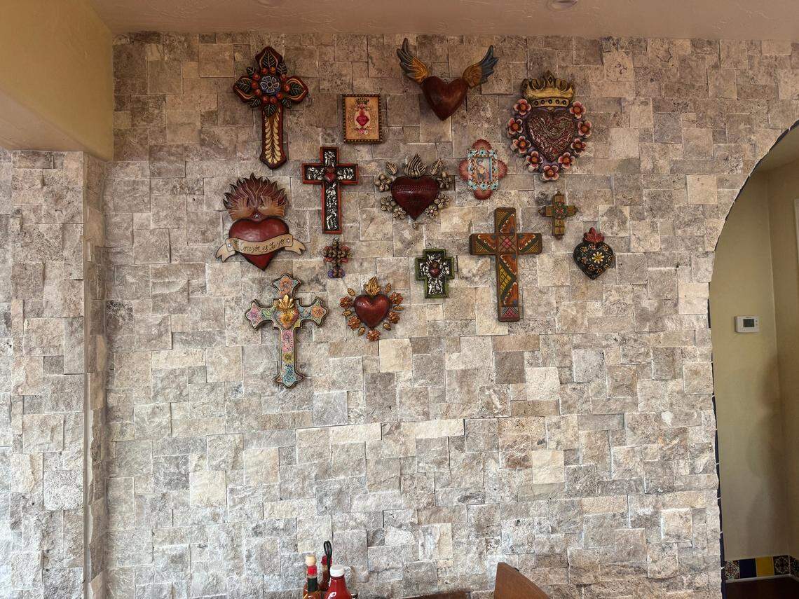 Crosses and hearts found on another one of the walls.