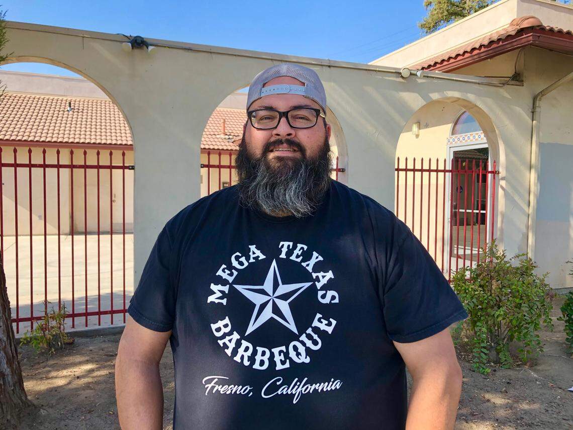 Anthony Vallejo, owner and pitmaster for Mega Texas Barbeque in Fresno, stands in front of the building in southeast Fresno where he plans to open a restaurant at the corner of Butler and Orange avenues in the coming weeks. He’s operated out of a gas station the past five years while building a large and loyal customer base.