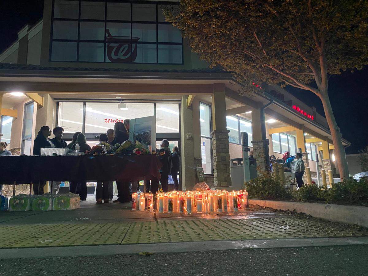Candles are placed in front of the Walgreens in Madera, California in remembrance of Erick Velasquez, who was shot and killed on Monday, March 31, 2025.