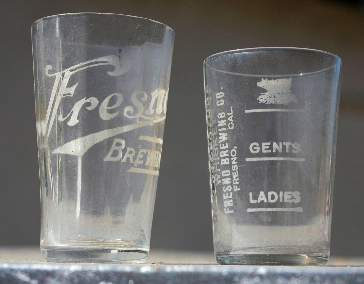 Glasses from the old Fresno Brewing Company. At right, different measurements of brew for different genders, with the top level, the fullest portion, showing an image of a hog.